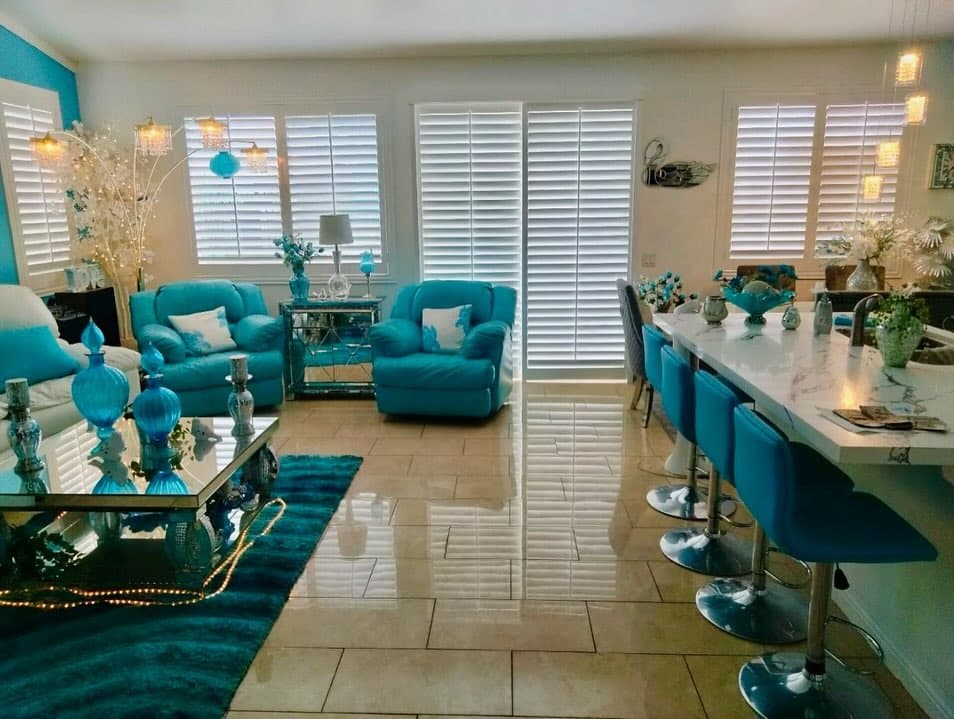 Professional installer working on window treatments